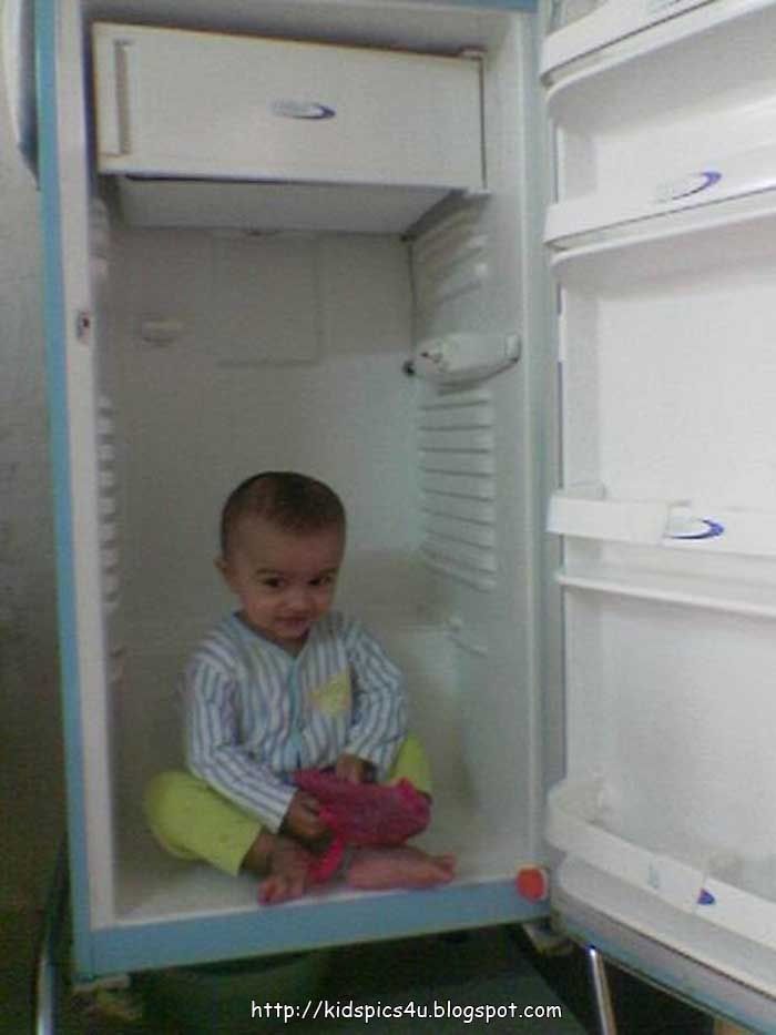 boy in empty fridge