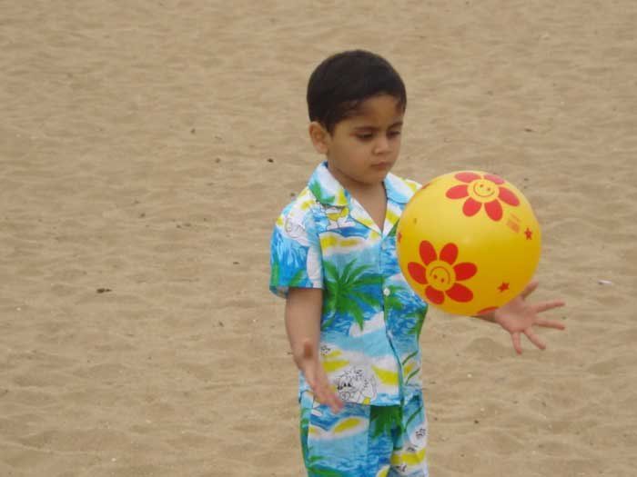 cute boy playing with ball